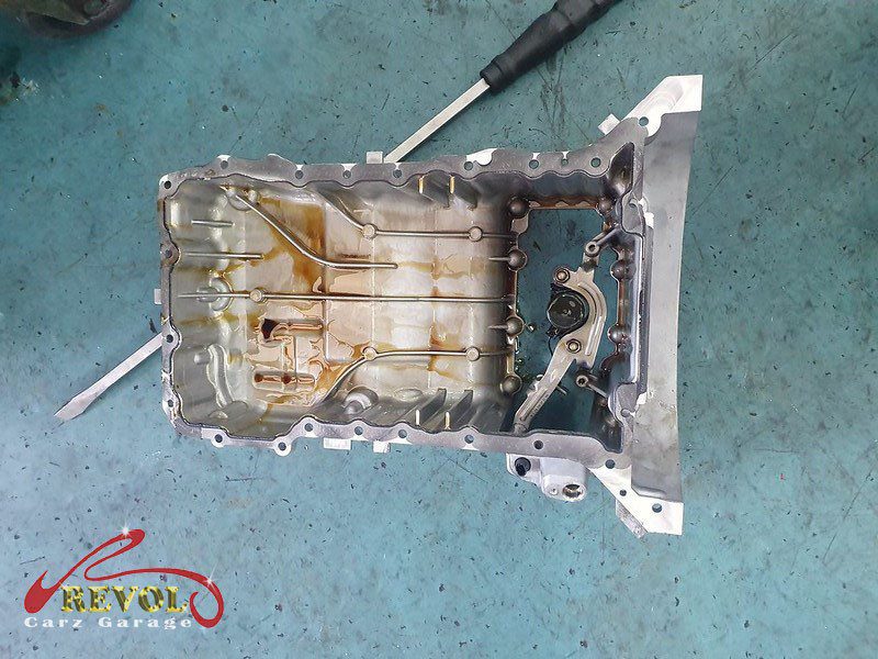 The old oil pressure regulating valve removed from the engine.