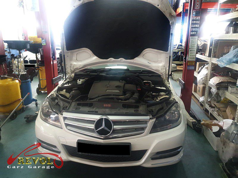 Mercedes-Benz C180 parked at the workshop for an oil change service.