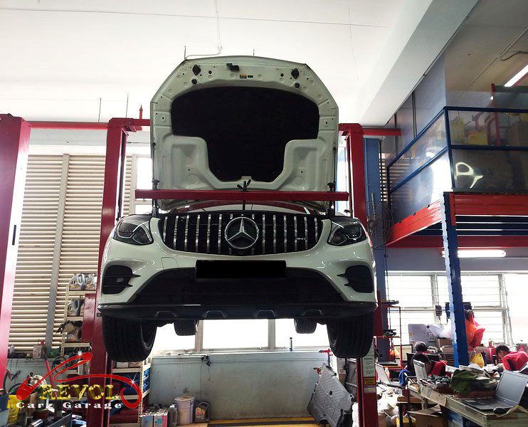 The GLC250 on the lift, the knock traced to the drivetrain mounts, not the undercarriage.