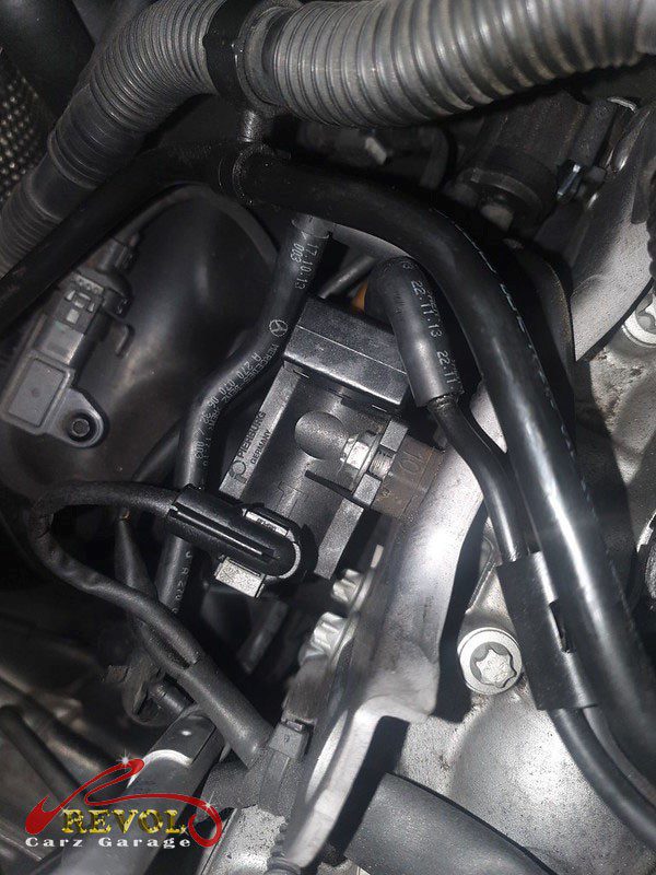 The old failed turbo diverter valve removed from the engine.