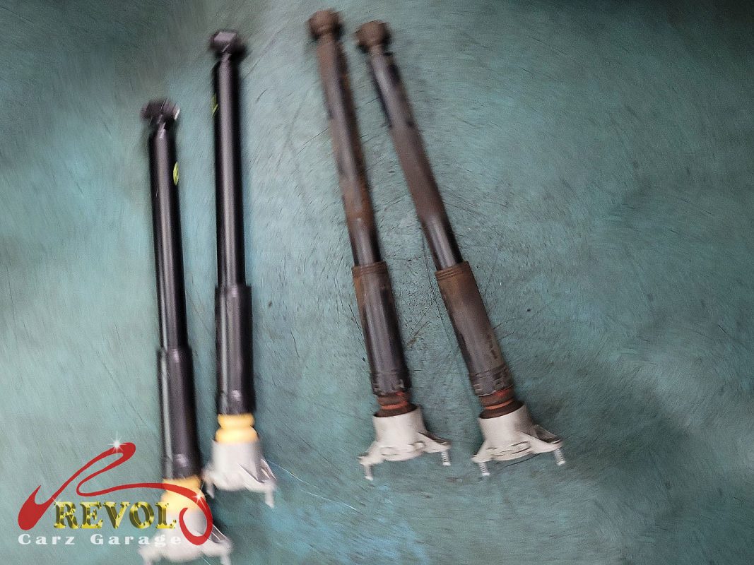 The new genuine Mercedes-spec front struts and top mounts ready to fit.