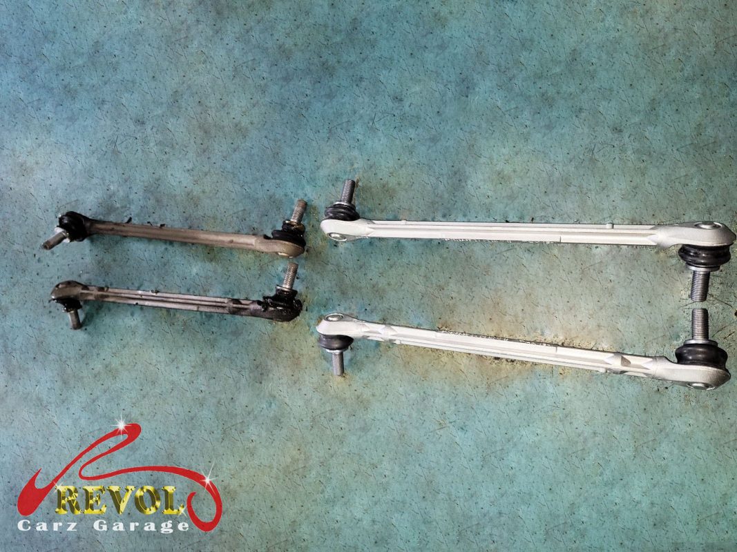 The old rear shocks removed alongside the new pair.