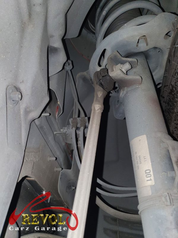 The front suspension checked on the Mercedes-Benz E200, the knock traced to the drop links.