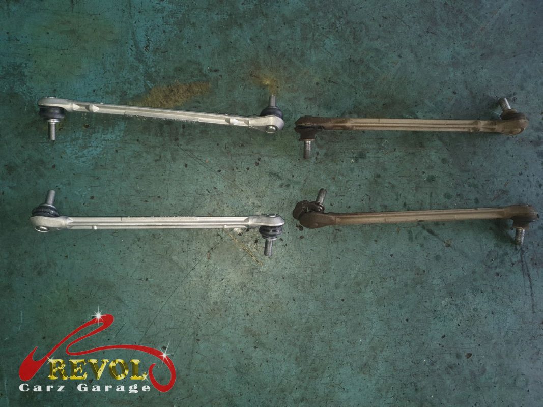 The old worn anti-roll bar drop links removed, ball joints loose.