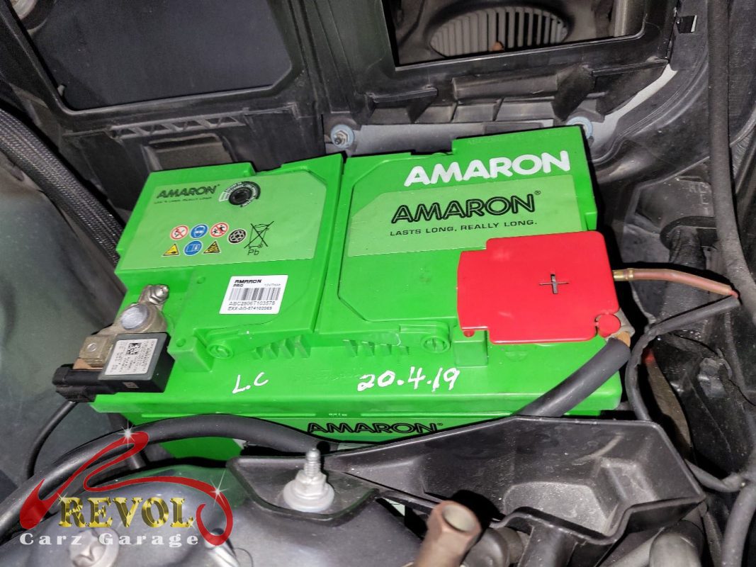 The old battery removed, caught before it failed completely.