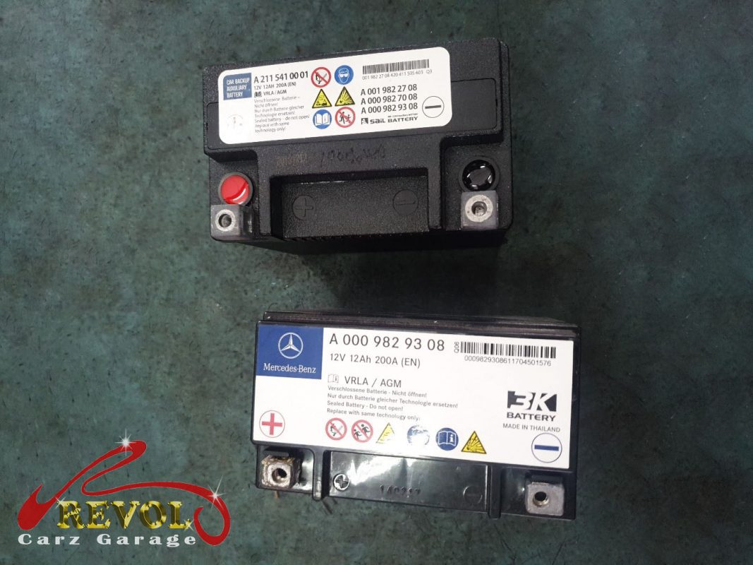 The old tired auxiliary battery removed from the car.