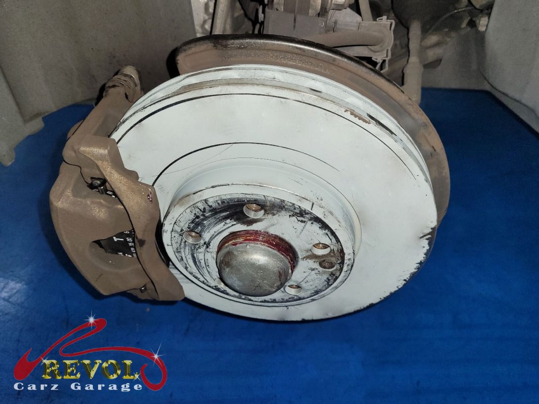 The new front brakes installed and the calipers serviced.