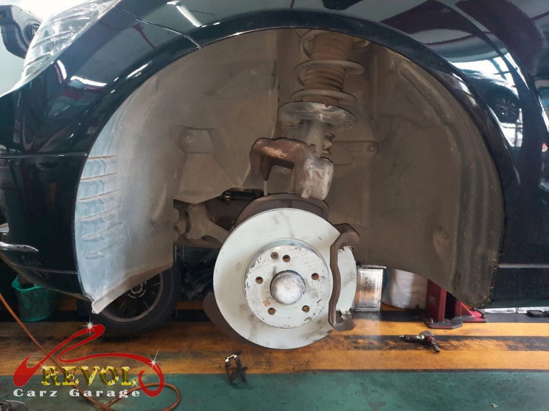 The new front brakes installed and the calipers serviced.