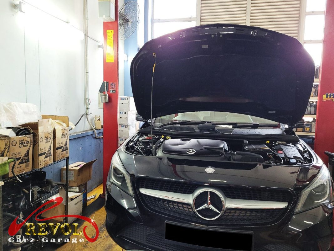The worn shock absorbers on the Mercedes-Benz CLA180, weeping and weak.