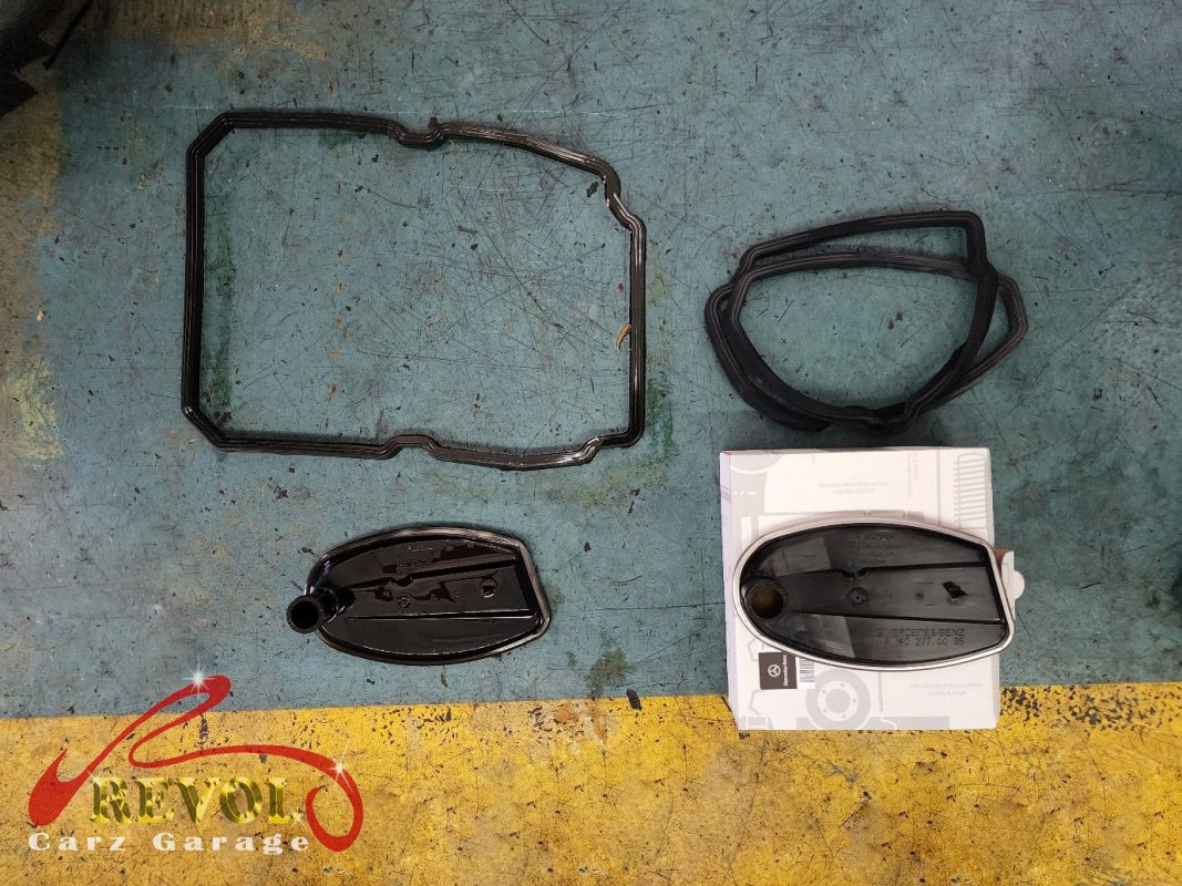 The new genuine Mercedes pan-and-filter assembly ready to fit.