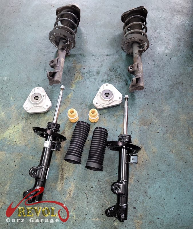 The worn shock absorbers on the Mercedes-Benz CLA180, weeping and weak.