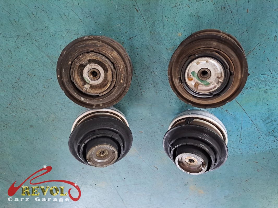 The sagged engine mount with cracked rubber removed.