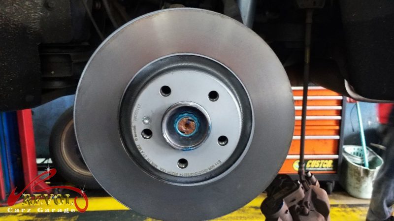 The new front brakes installed and the calipers serviced.