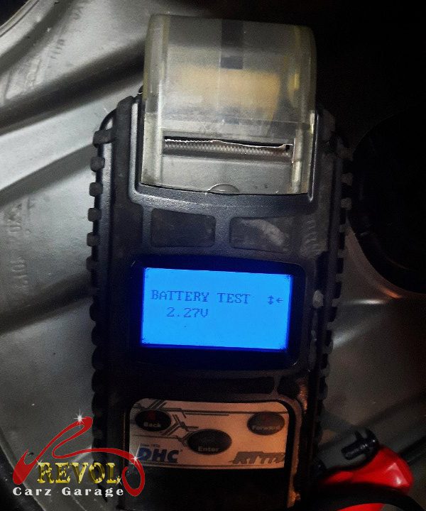 The old tired auxiliary battery removed from the car.