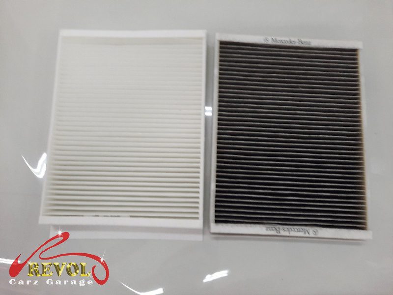 The old air and cabin filters removed alongside the new ones.