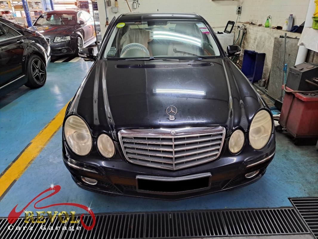 Mercedes-Benz E200 parked at the workshop, in for headlamp replacement.