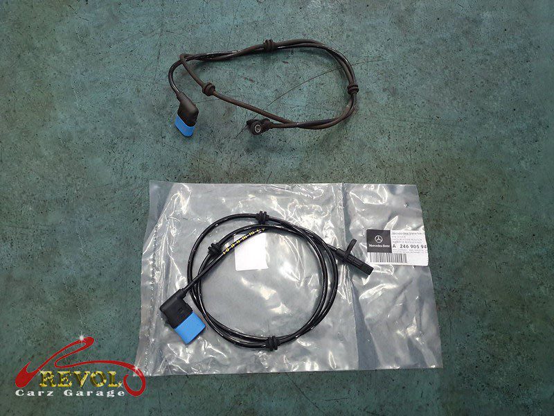 The old ABS sensor removed from the hub.