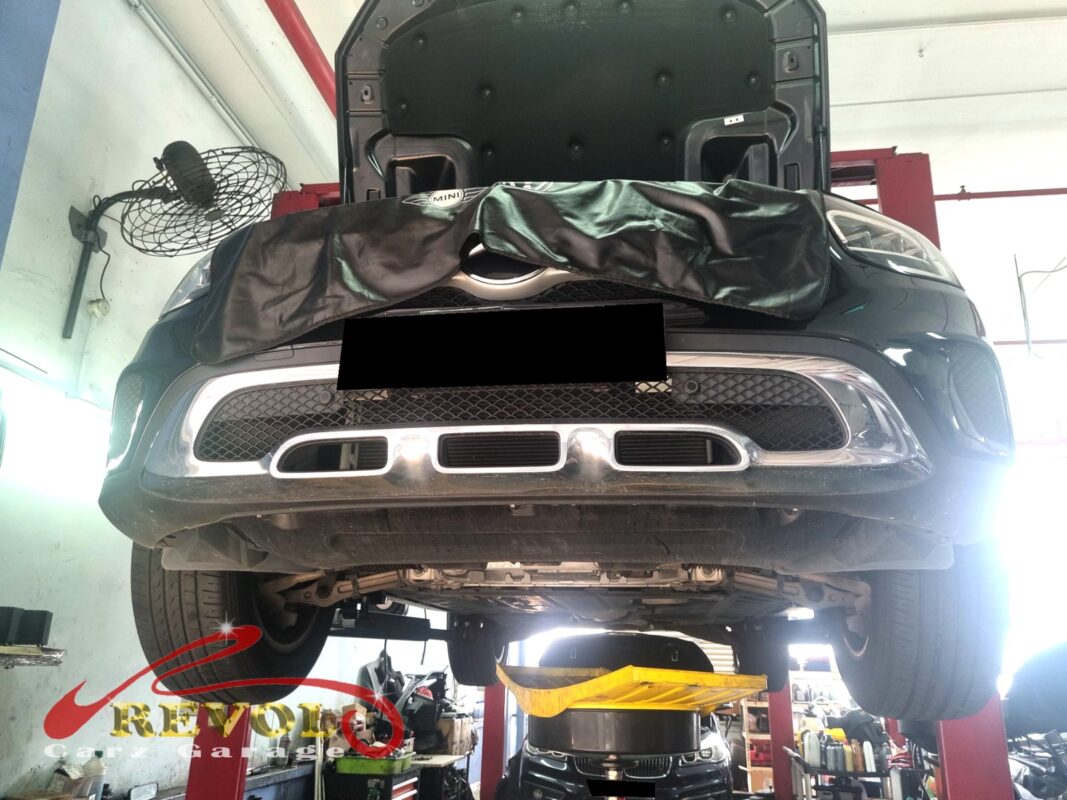 The GLC200 up on the two-post lift, fender cover on, in for the coolant leak.