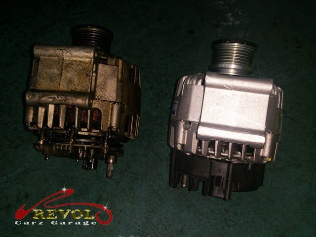 The faulty alternator removed from the engine block.
