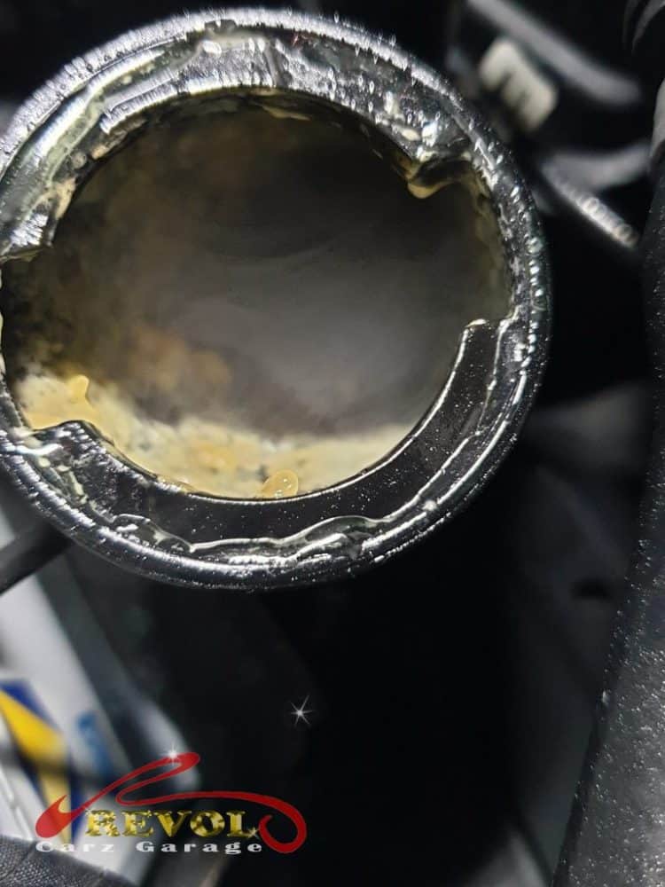 The AMG GT on the lift for the 360-degree undercarriage check, coolant found in the engine oil.
