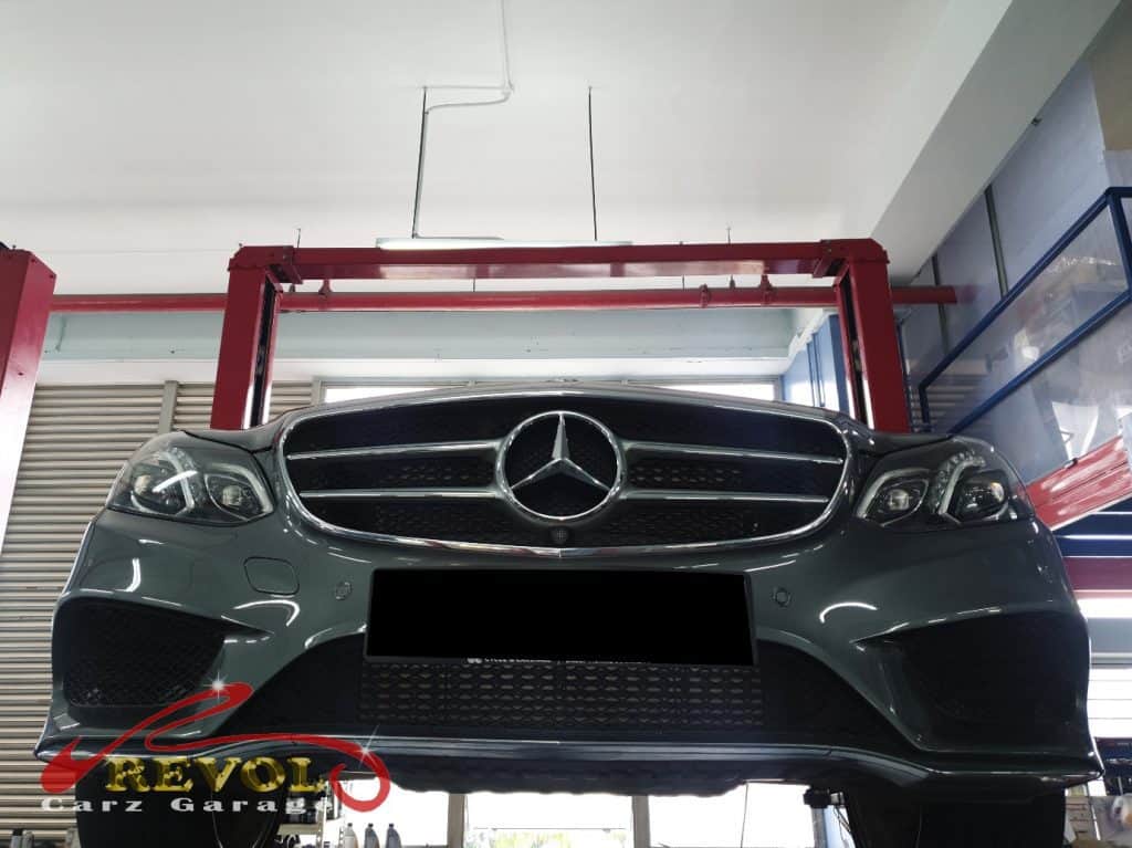 Mercedes-Benz E200 on the lift at the workshop for a major service.