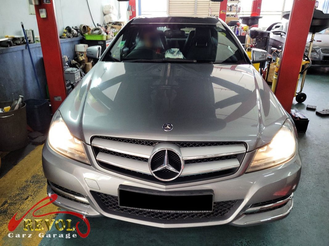 Mercedes-Benz C180 parked at the workshop, in for a valve cover oil leak diagnosis.