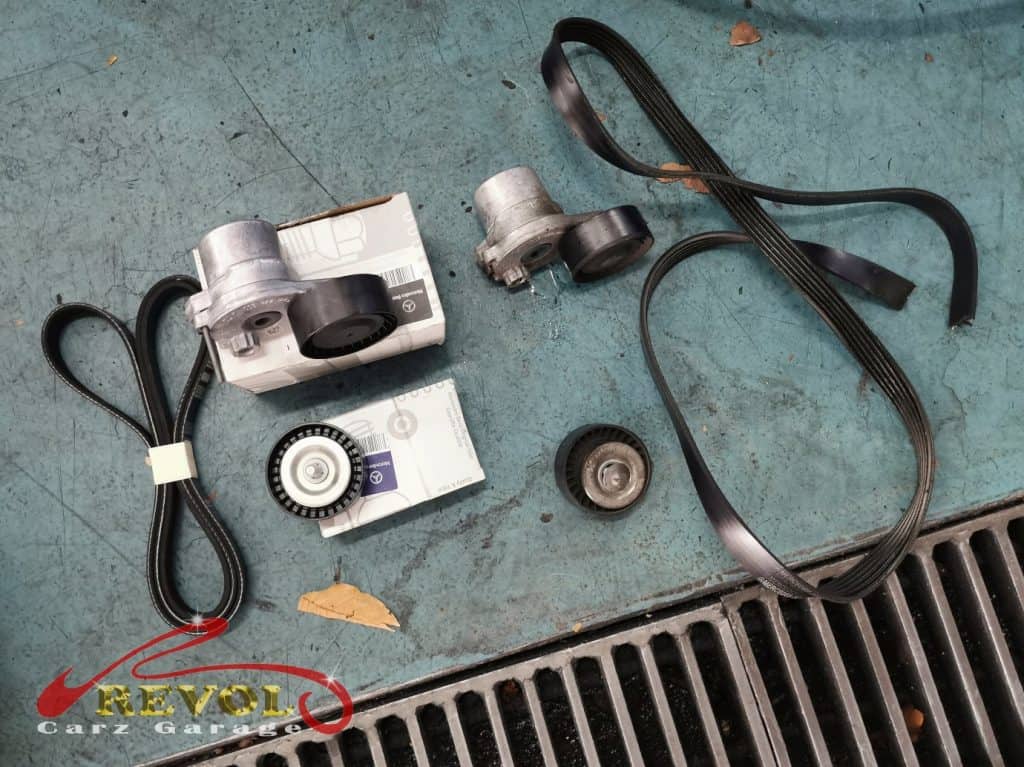The new genuine Mercedes-spec AC compressor, pulley and belt tensioner ready to fit.