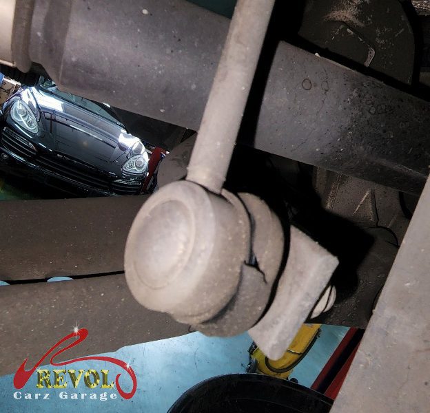 The worn shift linkage with play in its bushings on the Volkswagen Golf, and the new genuine VW-spec parts fitted and adjusted.