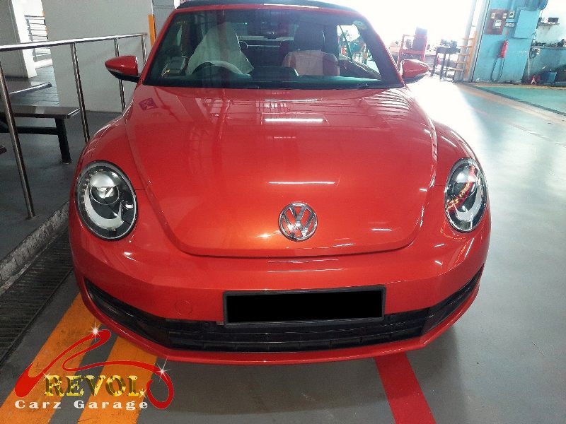Volkswagen Beetle parked at the workshop for routine servicing.
