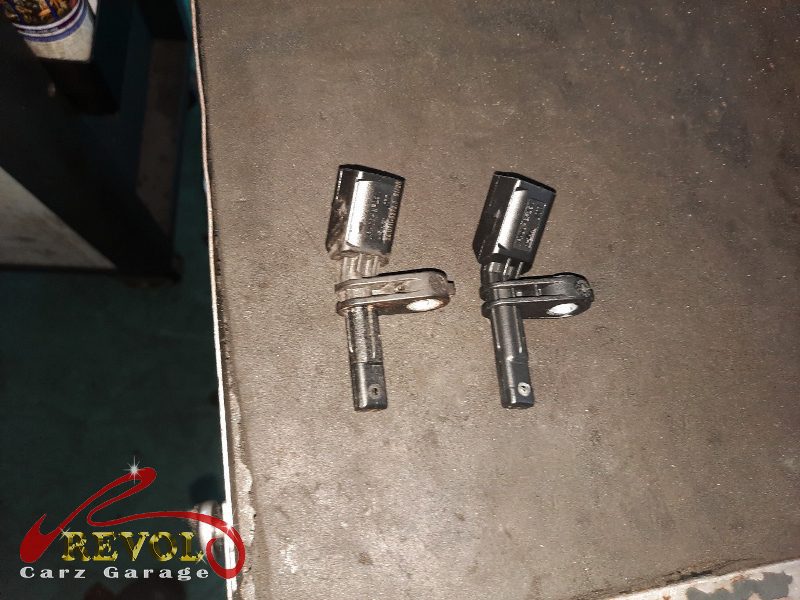 The old ABS sensor removed from the hub.