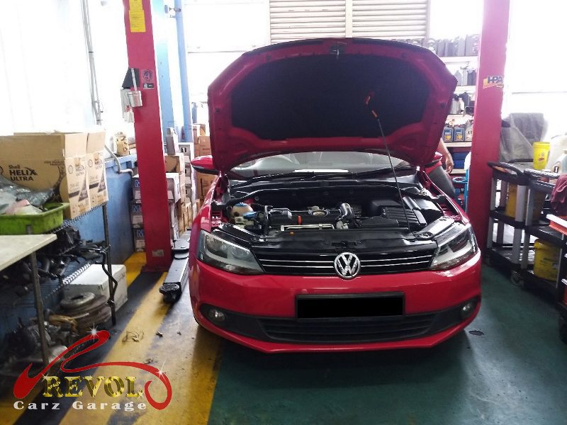 Volkswagen Jetta parked at the workshop for a drive belt service.