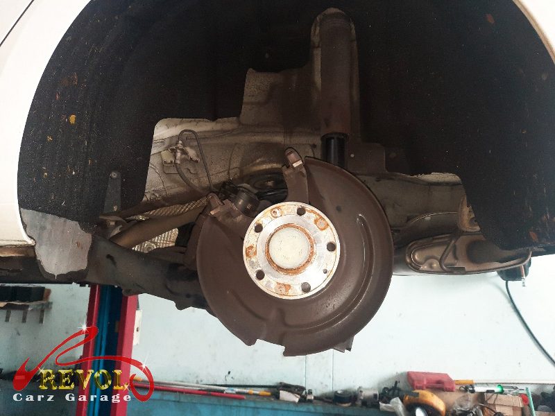 The old front discs removed alongside the new set.