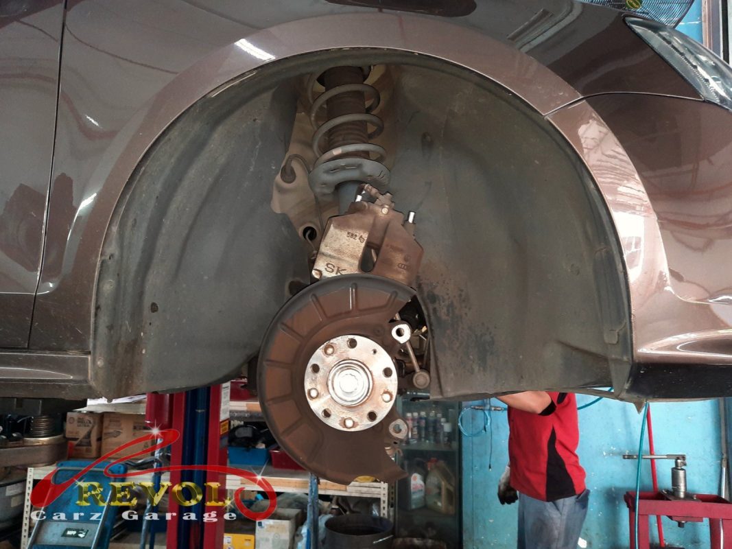 The old front discs removed alongside the new set.