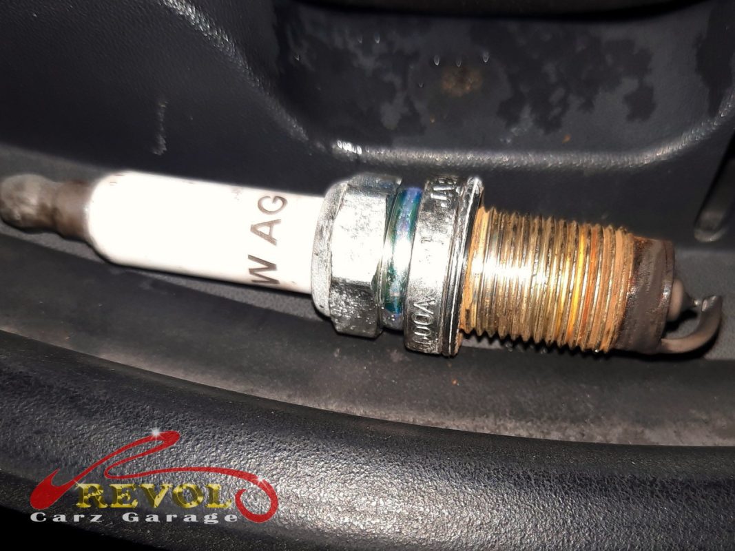 The old worn spark plugs removed, electrodes rounded off and gaps opened up.