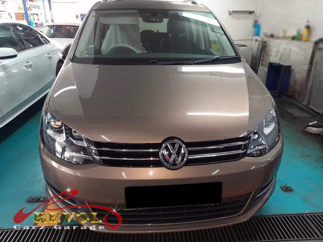 Volkswagen Touran parked at the workshop, in for cooling system inspection.