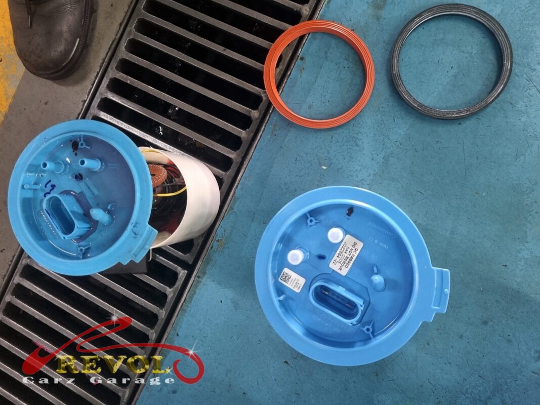 The old in-tank fuel pump assembly removed.