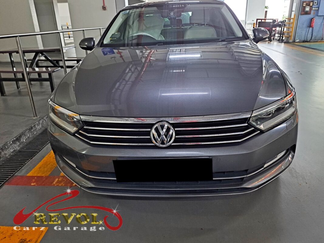 Volkswagen Passat parked at the workshop for maintenance servicing.