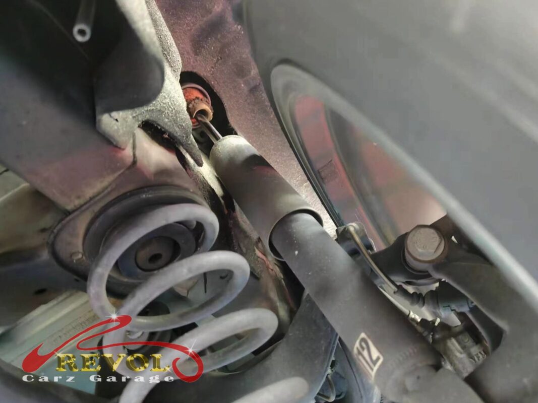 The old rear shocks removed beside the new VW-spec pair.