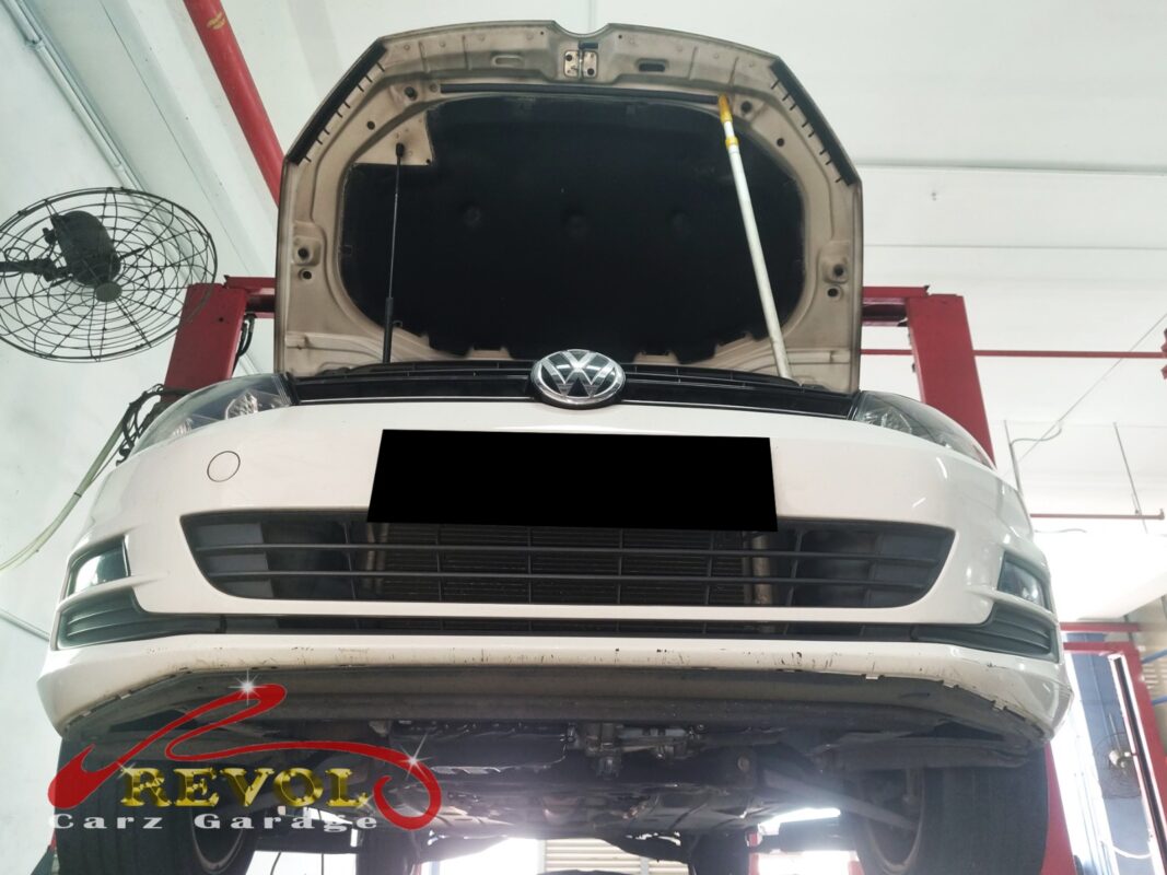 Coolant traces around the thermostat housing on the Volkswagen Golf.