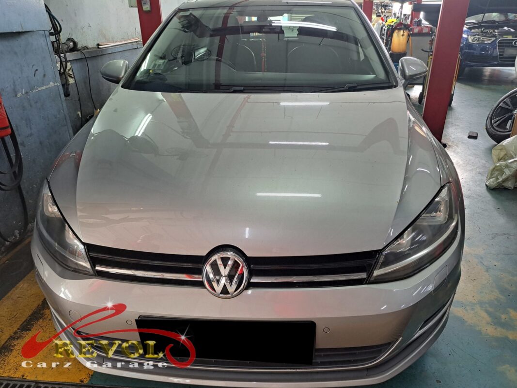 Volkswagen Golf parked at the workshop, in for a scheduled spark plug change.
