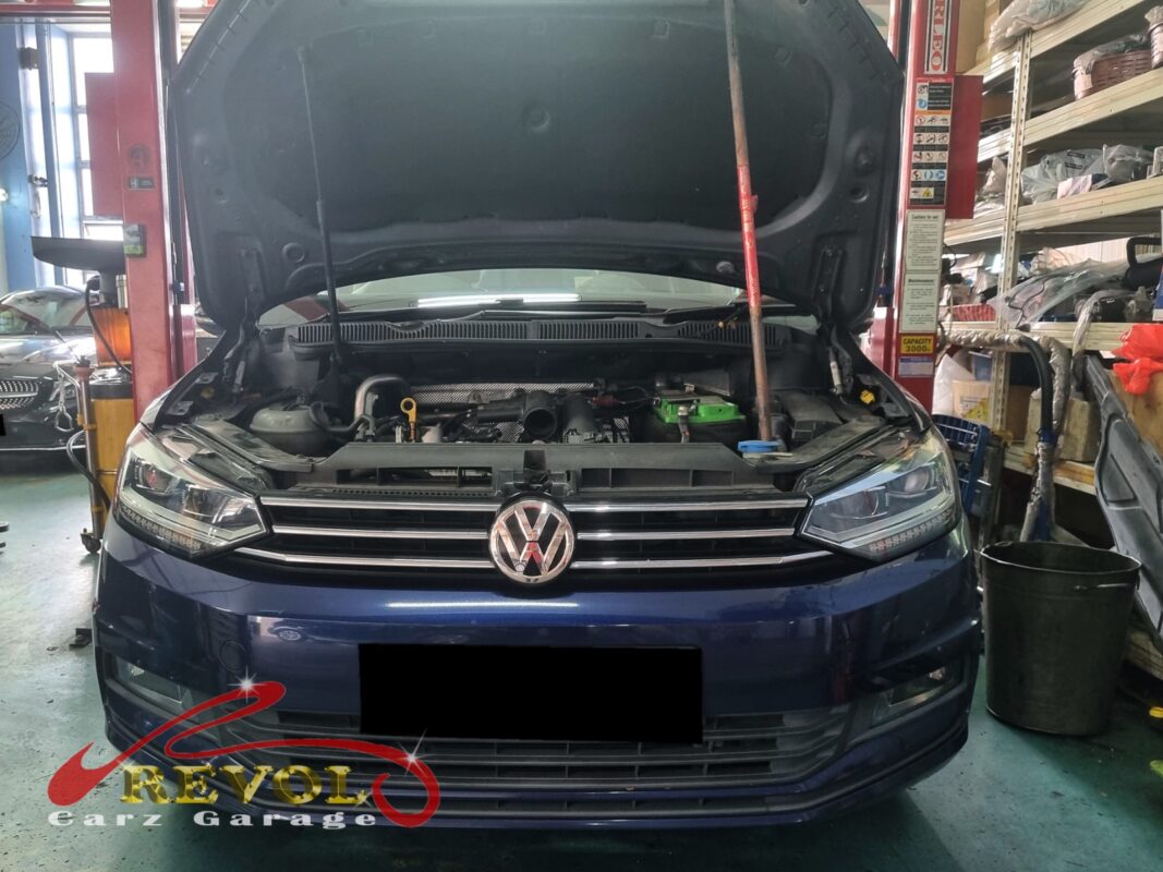 Volkswagen Touran with the engine bay open for aircon compressor replacement.