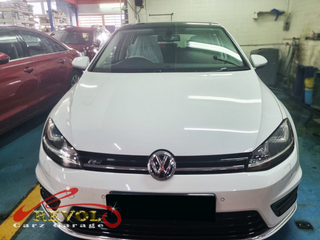 Volkswagen Golf with the engine bay open for mount replacement.