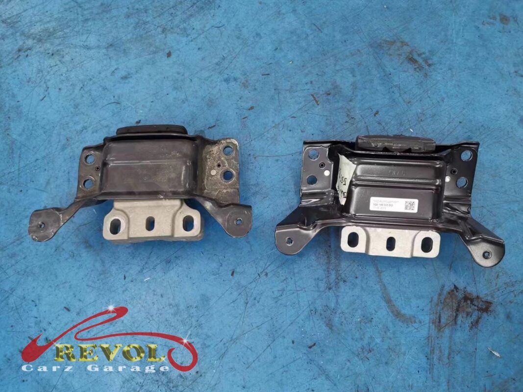 The old transmission mount (left) beside the new VAG-spec replacement (right).