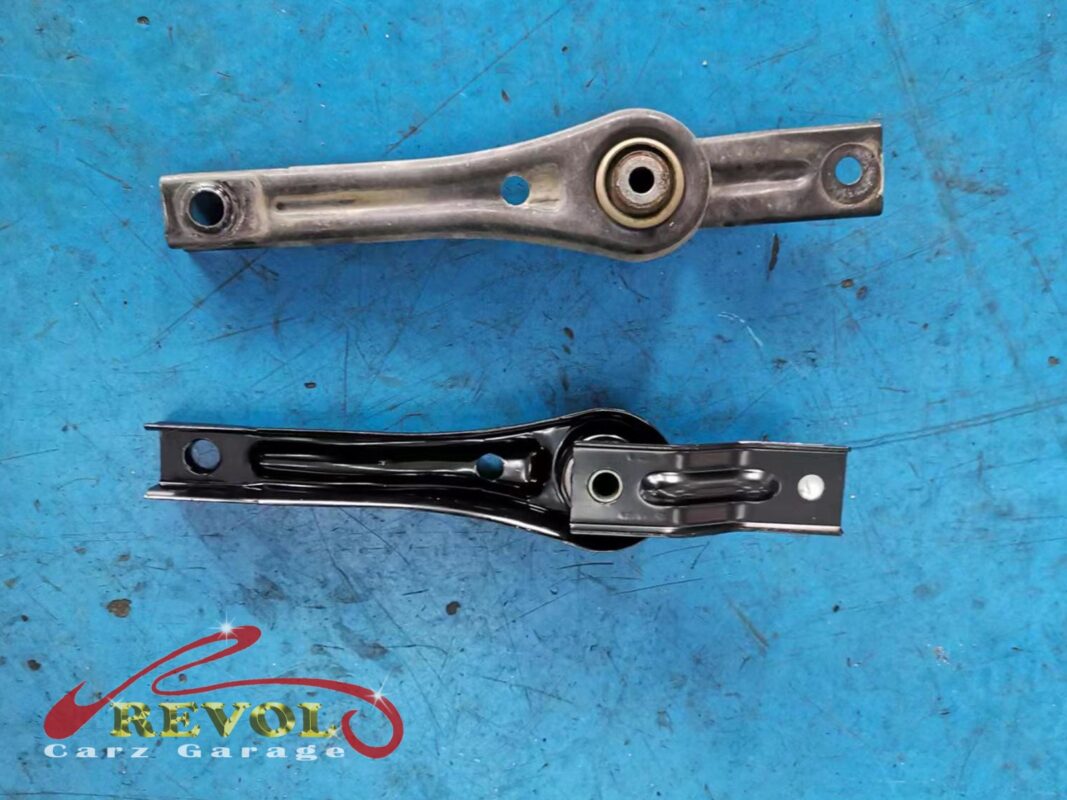 The old lower torque link (top) beside the new VAG-spec replacement (bottom).