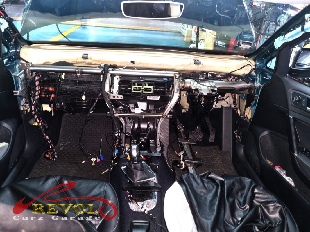 The dashboard stripped right out, the HVAC box exposed to reach the cooling coil.