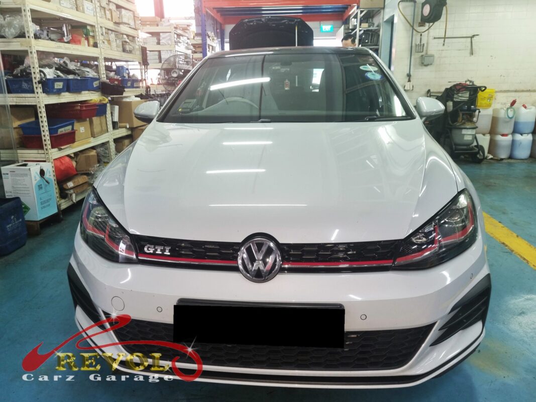 Volkswagen Golf in the workshop for ABS wheel speed sensor replacement.
