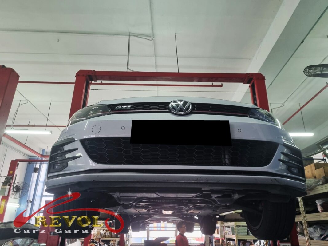 The Golf GTI up on the two-post lift, hood open, for the sensor swap.