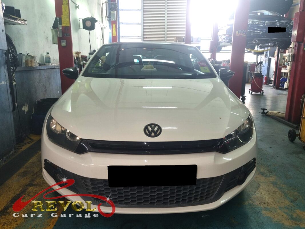 Volkswagen Scirocco with the rear seat lifted for in-tank fuel pump access.