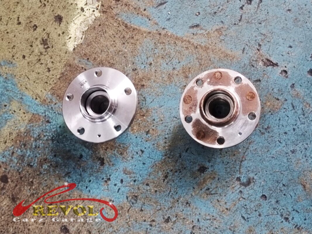 Another angle: the new hub bearing unit (left) next to the chewed-up original (right).