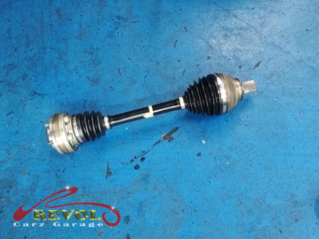 The driveshaft out of the car, both CV joints opened up and resealed with new boots.